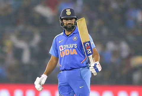India's Rohit Sharma raises his bat to celebrate his fifty. (Photo | AP)