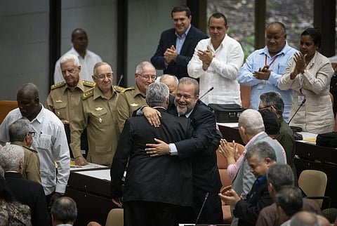 Cuban Prime Minister Manuel Marrero Cruz embraces Cuba's President Miguel Diaz-Canel during the closing session at the National Assembly of Popular Power in Havana, Cuba, Saturday. (Photo | AP)