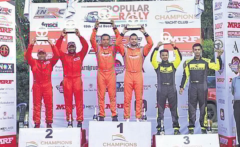 Winners of the Popular Rally pose with their trophies in Kottayam on Sunday