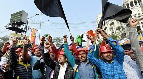 Protestors hold placards and raise slogans during a demonstration against the Citizenship Amendment Act and NRC in Kolkata Sunday Dec. 22 2019. (Photo | PTI)