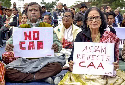 Senior citizens display placards during a protest against the Citizenship (Amendment) Act at Latashil Playground in Guwahati (Photo| PTI)