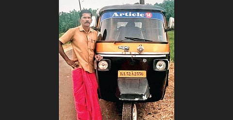 Puthedath Vallapil Kunhukuttan standing beside his auto sporting the name “Article 14”. In Anakkara. (Photo | EPS)