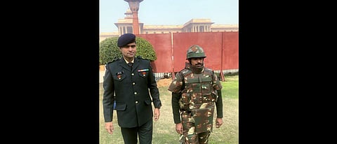 Maj Anoop Mishra of the Indian Army with an Army jawan with his full body protection bullet-proof jacket which can withstand even sniper rifle bullets from 10 meters distance, in New Delhi on Tuesday. (Photo | ANI)