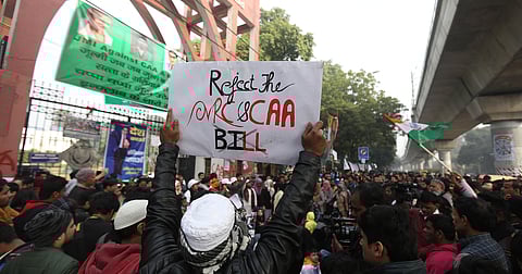 Protestors including students and local residents during a demonstration against the Citizenship Amendment Act CAA outside Jamia Millia Islamia University in New Delhi on Saturday.  (Photo | Arun Kumar P/EPS)