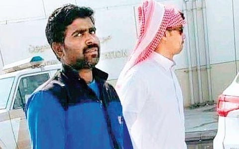 A picture of Harish Bangera being arrested by  a Saudi official, is trending on social media