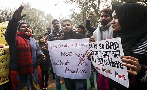 Protesters holding placards during a protest against the Citizen Amendment Act. (Photo| ANI)