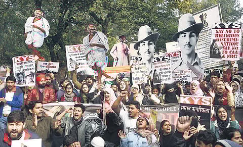 Protesters march to Jantar Mantar carrying cutouts of BR Ambedkar