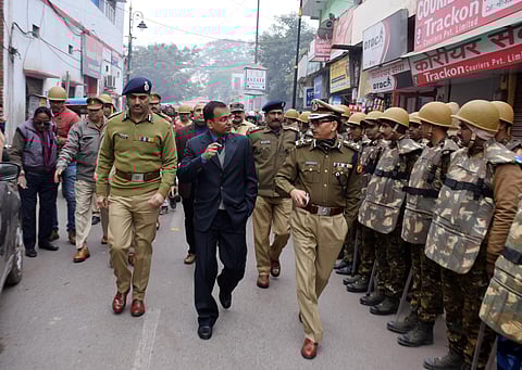 Senior police officers conducting a rousing march as security system tight up in Varanasi. (Photo | ANI)