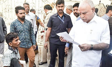 Chief Minister BS Yediyurappa interacts with people during Janata Darshan, in Bengaluru on Friday | Express