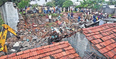 Debris of the wall that collapsed  on three tiled-roof houses following heavy rain at Nadur in Mettupalayam on Monday | A RAJA CHIDAMBARAM