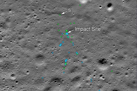 This image shows the Vikram Lander impact point and associated debris field. Green dots indicate spacecraft debris (confirmed or likely). Blue dots locate disturbed soil, likely where small bits of the spacecraft churned up the regolith. 'S' indicates deb