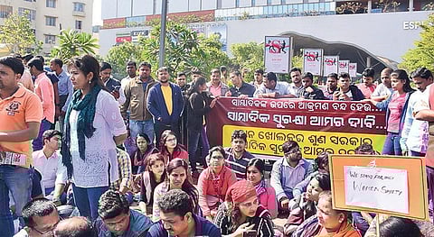 Journalists staging protest in front of Esplanade One mall in Bhubaneswar  on Sunday. (Photo | EPS)