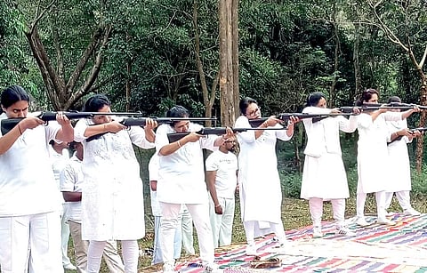 Women take part in a gun training event in Gonikoppal. (Photo | EPS)