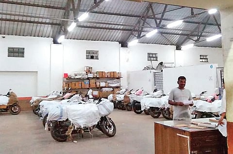 Packages and two-wheelers wait to be collected at the Railway Parcel Office