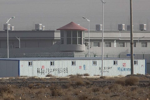 A guard tower and barbed wire fences are seen around a facility in the Kunshan Industrial Park in Artux in western China's Xinjiang region (File photo| AP)