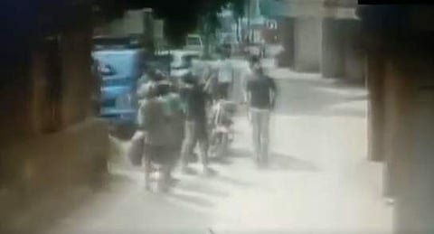 Onlookers form human chain to save the toddler. (Photo | Video screengrab)