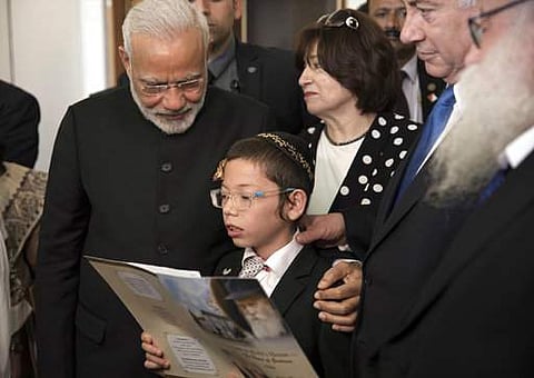 PM Narendra Modi meeting Moshe Holtzberg during his visit to Israeli in July last year (File photo| AP)