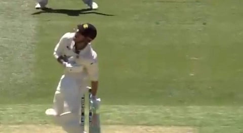 Marcus Stoinis reacts after getting hit by the ball. (Screengrab of Twitter video)