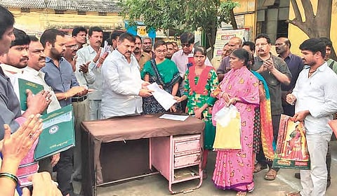 Musheerabad MLA M Gopal presents an appointment letter to the son of a deceased RTC employee in Hyderabad on Friday