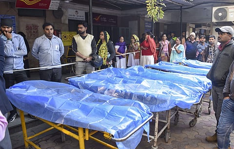 Stretchers are seen outside the emergency ward of Lady Hardinge Hospital where victims of a fire at a factory in Rani Jhansi Road have been admitted. (Photo | PTI)