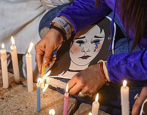 A candlelight march demanding justice for rape victims underway at UP Bhawan in New Delhi. (Photo | PTI)