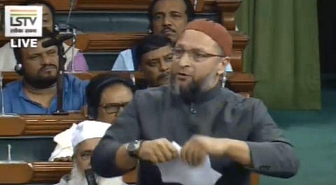 AIMIM leader Asaduddin Owaisi tearing a copy of the Citizenship Amendment Bill in Lok Sabha on Monday, December 9, 2019. (Photo | Twitter)