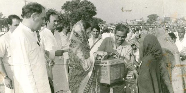 Sonia Gandhi distributing utensils to some Banjara women. Then PM Rajiv Gandhi is also seen. (File Photo | PTI)