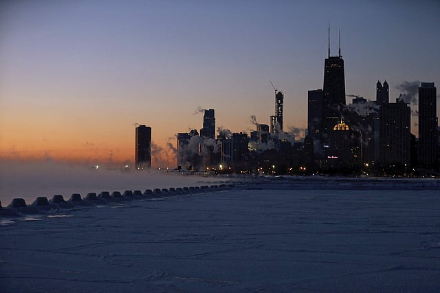 The dramatic warm-up will offer a respite from the bone-chilling cold that canceled school, closed businesses and halted trains. But potholes will appear on roads and bridges weakened by the freeze-thaw cycle. IN PIC: Ice forms along the shore of Lake Michigan before sunrise. (Photo | AP)