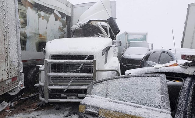 Cars and trucks were part of a 21 vehicle pileup in Batavia, New York. Police said the crash shut down the New York State Thruway where heavy snow and high winds made driving treacherous. (Photo | AP)