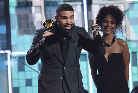 Drake accepts the award for best rap song for 'God's Plan' at the 61st annual Grammy Awards on Sunday. The song made Drake the first solo male artist with two 10-week No. 1 songs on the Billboard Hot 100 charting history. (Photo: AP)