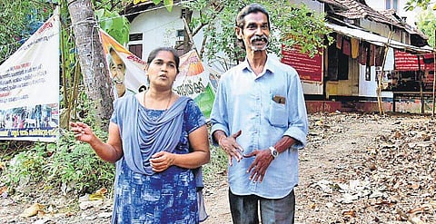 Preetha Shaji and her husband in front of the property at Pathadippalam after the High Court verdict on Tuesday | Albin Mathew