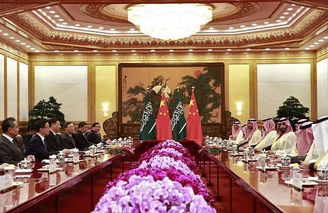 Saudi Crown Prince Mohammed bin Salman (4th R) attends a meeting with Chinese President Xi Jinping (3rd L) at the Great Hall of the People in Beijing. | AFP