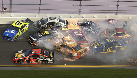 Cars crash in turn 3 during the NASCAR Daytona 500 auto race at Daytona International Speedway, Sunday, Feb. 17, 2019.