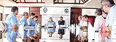 Southern Naval Command Chief Staff Officer (Technical) Commodore Ishan Tandon and Cochin Port Trust Chairman in Charge A V Ramana exchanging the MoU for expansion of the North Jetty at the Kochi Naval Base on Friday