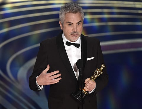 Alfonso Cuaron accepts the award for best cinematography for 'Roma' at the Oscars on Sunday, Feb. 24, 2019, at the Dolby Theatre in Los Angeles. (Photo | AP)