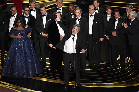 Peter Farrelly, center, and the cast and crew of 'Green Book' accept the award for best picture at the Oscars. (Photo | AP)