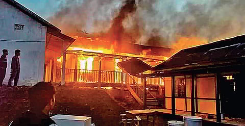 A building set on fire by a mob in Itanagar on Sunday | PTI