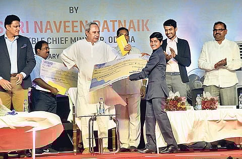 Chief Minister Naveen Patnaik felicitating para athlete Jayanti Behera | Express
