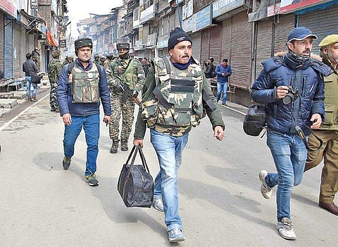 NIA officers leave after carrying out a search at the residence of JKLF Chairman Mohammad Yasin Malik in Srinagar on Tuesday | Zahoor Punjabi