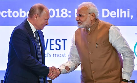 Prime Minister Narendra Modi shakes hands with Russian President Vladimir Putin during India-Russia Business Summit in New Delhi. | (File | PTI)