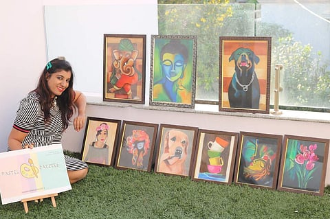 Ankita poses with all her artwork.
