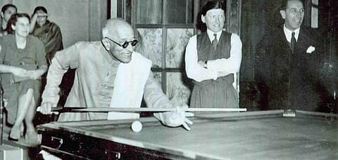 C Rajagopalachari trying a billiards shot at Government House, Delhi | govt archives