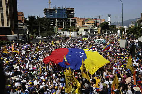 Anti-government protesters gather for the start of a nationwide demonstration demanding the resignation of President Nicolas Maduro, in Caracas, Venezuela. (Photo | AP)