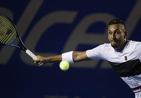 Australia's Nick Kyrgios plays a ball in his Mexican Tennis Open quarterfinal match against Switzerland's Stan Wawrinka, in Acapulco
