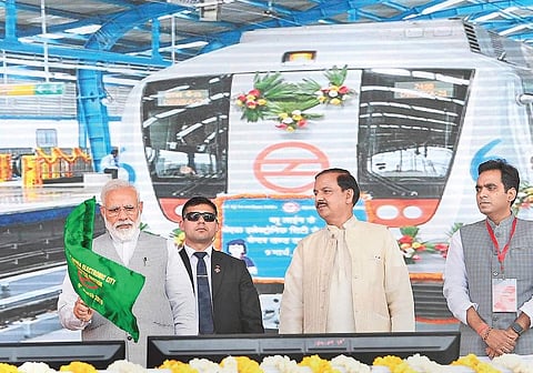 Prime Minister Narendra Modi flags off the Noida City Centre-Noida Electronic City section of Delhi Metro’s Blue Line at Greater Noida on Saturday, while Minister of State for Culture and Environment, Forest and Climate Change Mahesh Sharma looks on | PTI