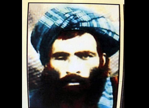 This picture taken in Kandahar on July 31, 2015 shows a calender bearing the image of the Afghan Taliban's deceased leader Mullah Omar. (Photo | AFP)