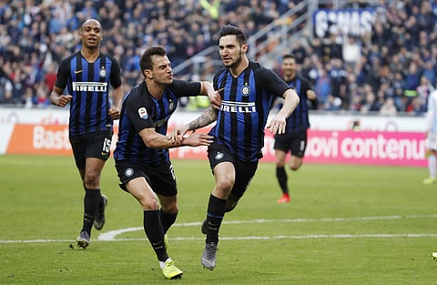 Inter Milan's Matteo Politano, right, celebrates after scoring his side's opening goal during the Serie A soccer match between Inter Milan and Spal at the San Siro Stadium, in Milan, Italy, Sunday, March 10, 2019. | AP