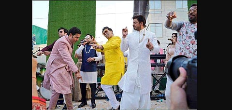 Akash Ambani, Karan Johar, Shah Rukh Khan, Hardik Pandya and Mika Singh on the dance stage at Akash Ambani and Shloka Mehta's wedding. (Photo | Twitter)