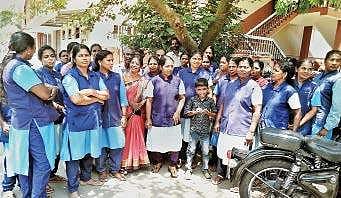 Women employees who are on a protest seeking pending salary  Express