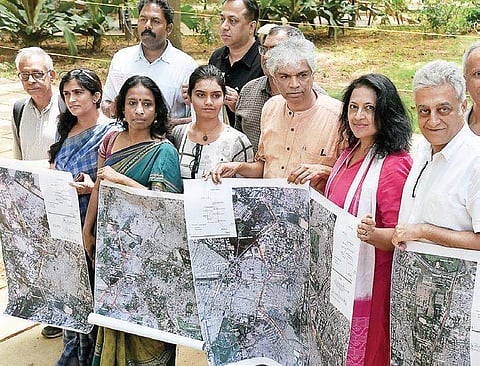 Citizens from various groups join hands to protest against the proposed elevated corridors in Bengaluru on Thursday.(Photo | Pushkar V)